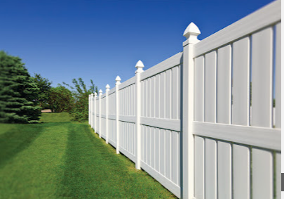 Gallo Fence contractor smiling in front of new wood fence